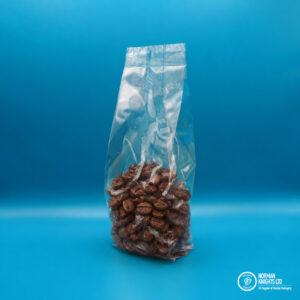 Coffee inside clear natureflex packaging.